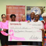 SYGNUS STANDS FIRM IN ITS SUPPORT OF THE FIGHT AGAINST BREAST CANCER THROUGH A DONATION OF J$500,000 FOR SCREENING AND FINANCIAL AID